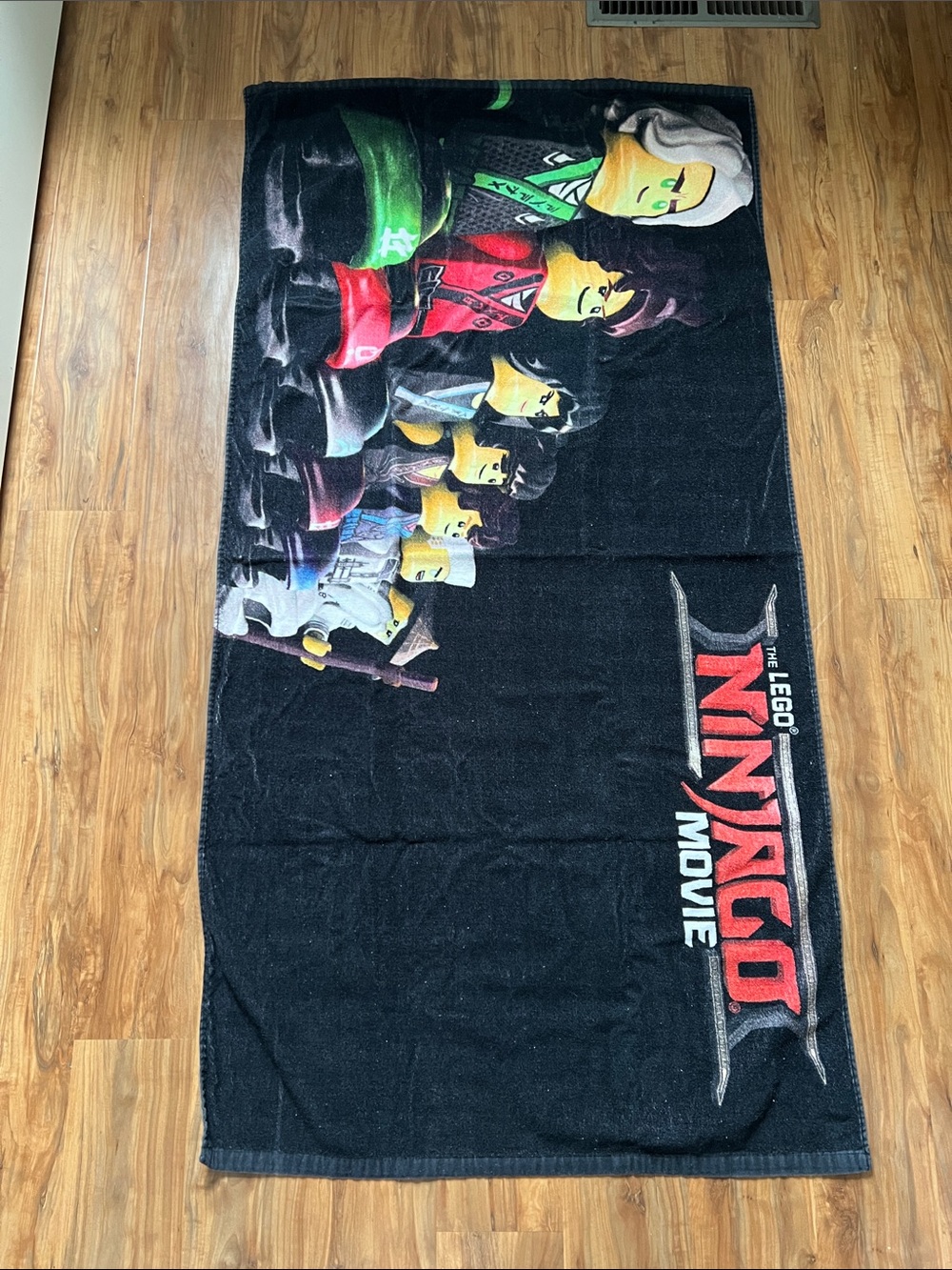 Lego Black Ninjago Movie Character Print Towel with Red, Green, Yellow Accents